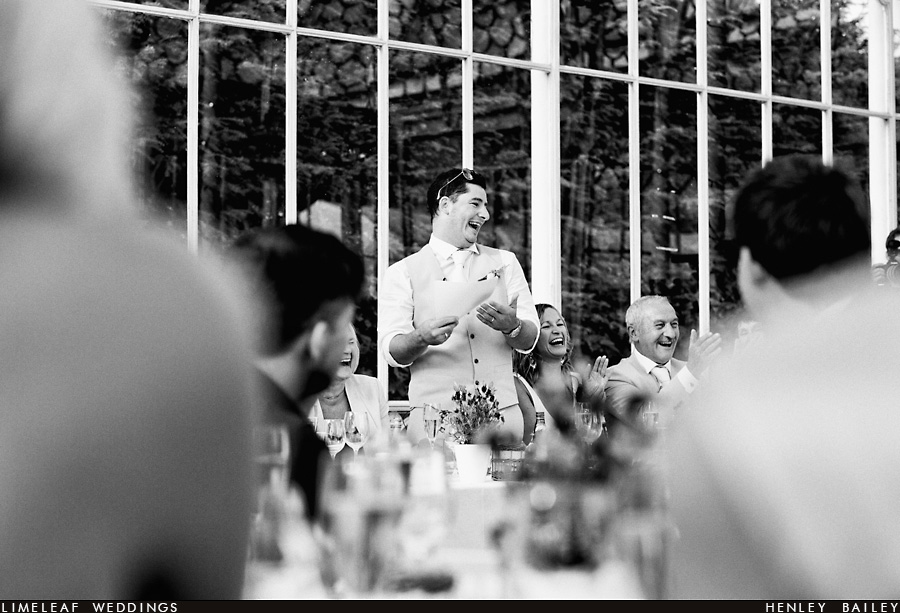 Groom laughs during his wedding speech
