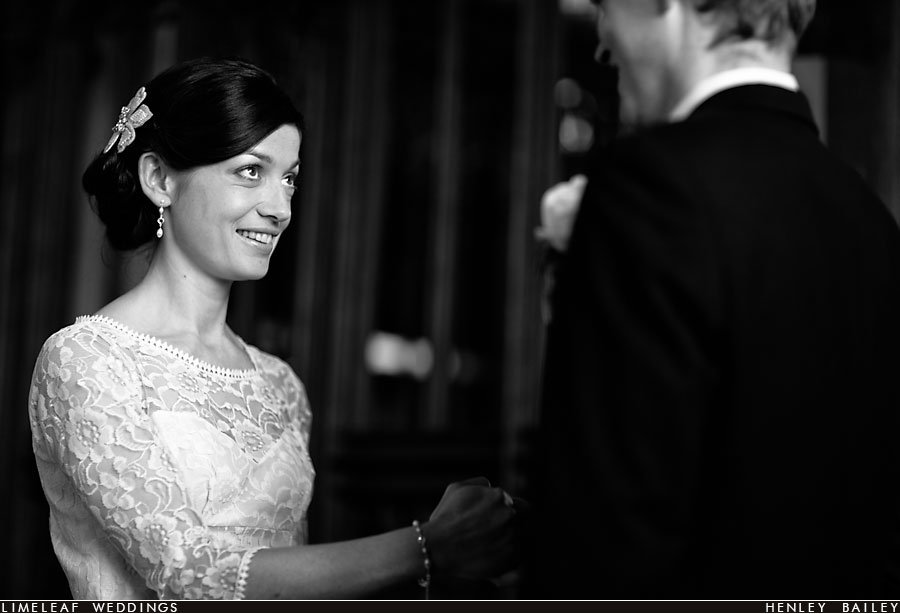 Bride smiles at her new husband during their wedding vows