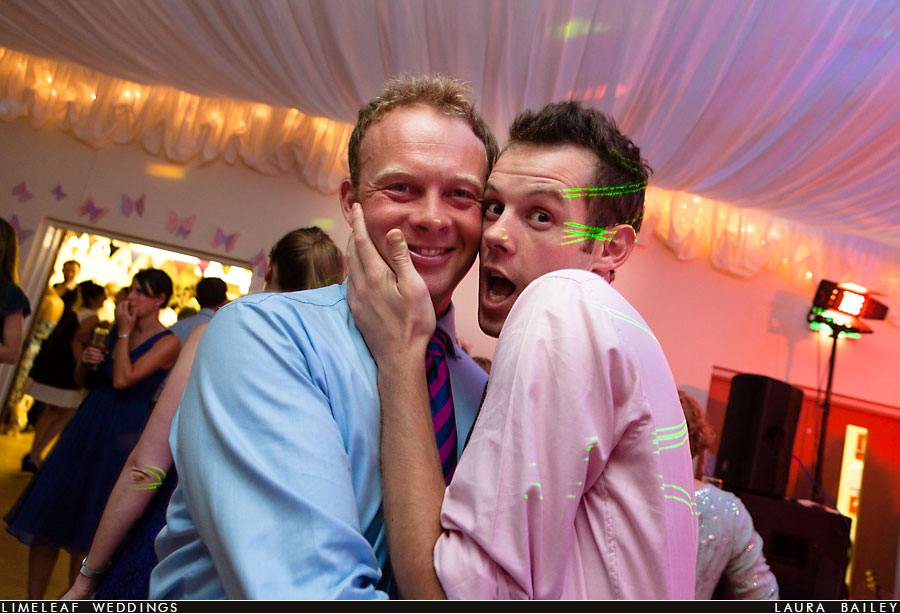 wedding guests pose for the camera during the evening reception
