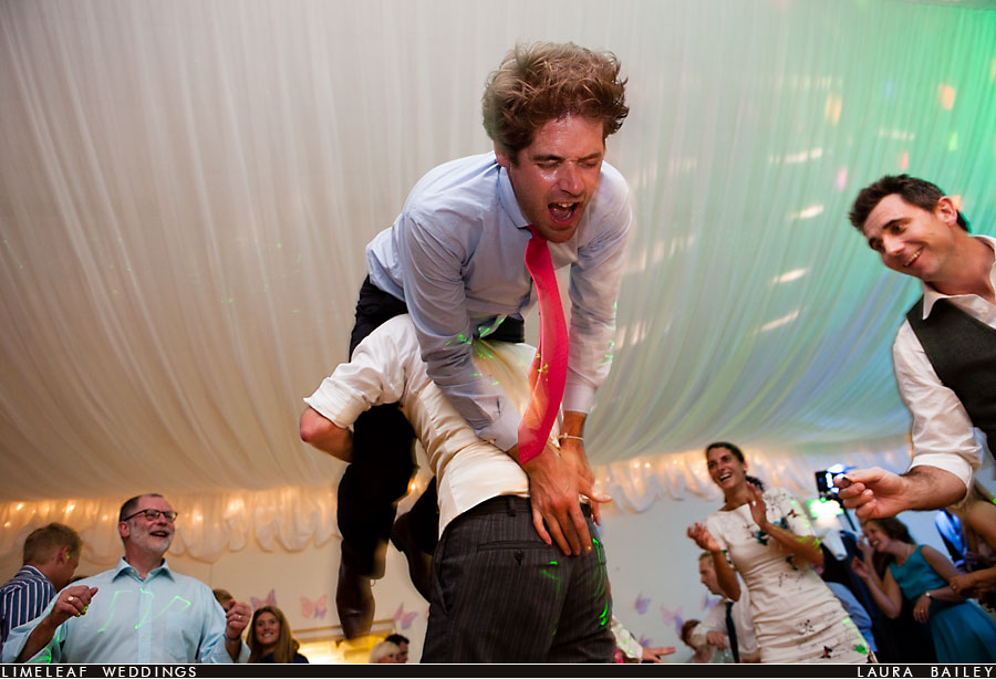 wedding guest gets spun round by groom